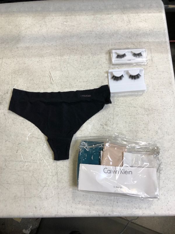 Photo 1 of 3 pack of calvin klein thongs s and eye lashes 