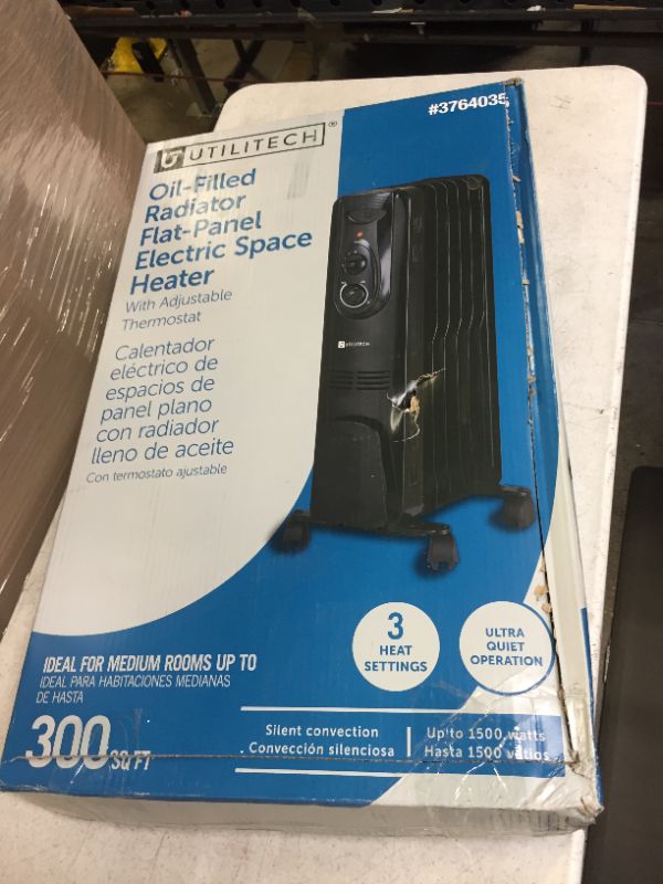 Photo 1 of Utilitech 1500-Watt Convection Flat Panel Indoor Electric Space Heater with Thermostat
