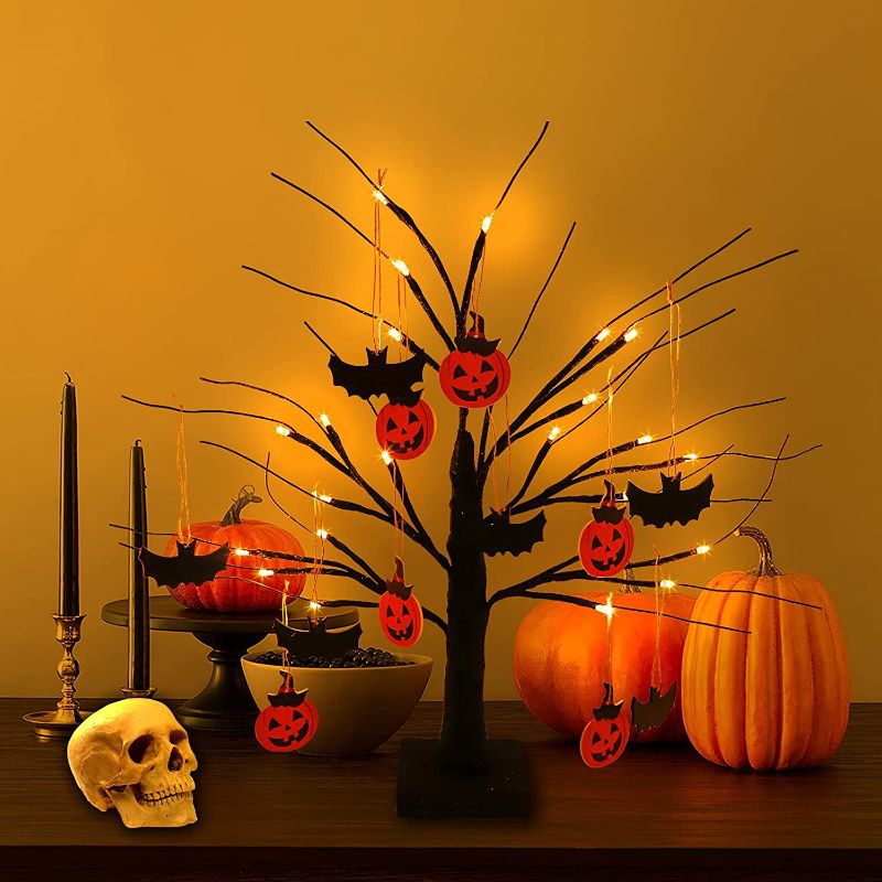 Photo 1 of Halloween 1.8FT Black Spooky Tree Battery Powered with 24 LED Warm White Lights, 6 Pcs Pumpkin Ornaments and 6 Pcs Bat Ornaments, Light Up Bonsai Tree for Halloween Indoor Tabletop Home Decorations
