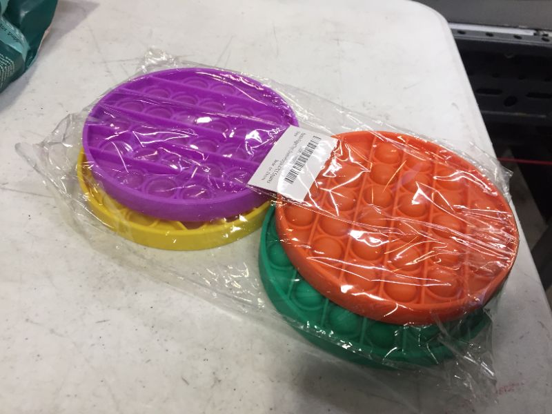 Photo 1 of 4 piece fidget poppers -- different colors 