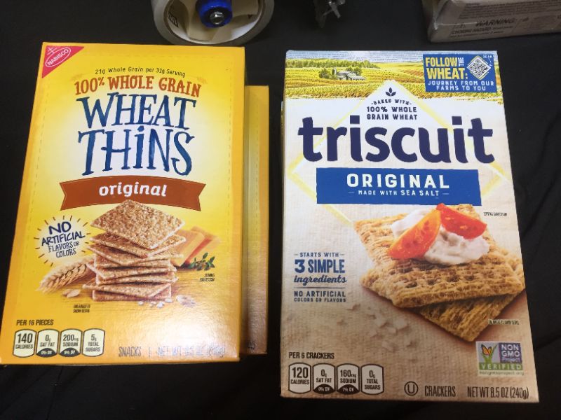 Photo 1 of 2 boxes of wheat thins and 2 boxes of triscuit snacks 
best by 1/12/2022