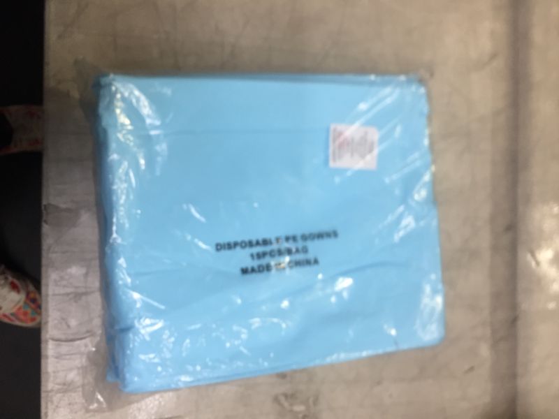Photo 2 of Disposable Blue Robes. Pack of 15 Adult Clothing Regular. CPE 0.04 mm Robes with Long Sleeves, Waist Ties, Apron-Style Neck. Over-The-Head, Open-Back Coats. Poly Coated Clothing