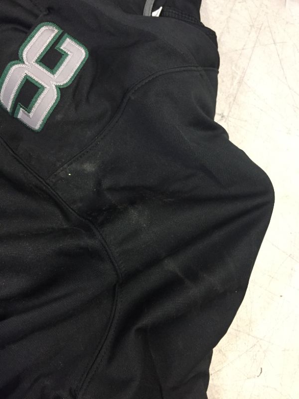 Photo 2 of GENERIC FOOTBALL JERSEY BLACK AND GREEN (DILLON NUMBER 28) MARKED AS SIZE LARGE -- SLIGHT DAMAGE TO NUMBER IN BACK 