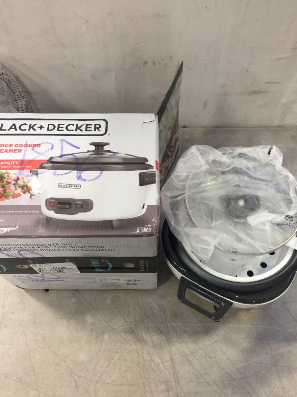 Photo 4 of BLACK+DECKER Rice Cooker, 6-cup, White -- CENTER COIL POSSIBLY LOOSE 
