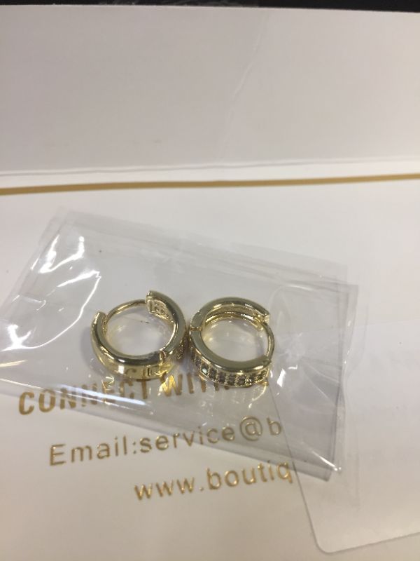 Photo 3 of Small Gold Huggie Hoop Earrings for Women | 14K Real Gold Plated CZ Cartilage Cuff Earrings for Girls *** EARRINGS ARE GOLD, COLOR IS DULLED IN LIVE PHOTO FROM CAMERA QUALITY ***
