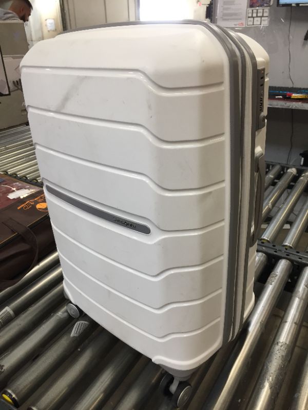 Photo 1 of 28 inch white hard case luggage ----large scratches/dirt scuffs