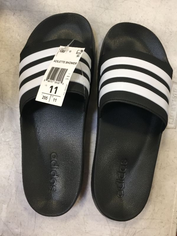 Photo 2 of adidas Men's Adilette Shower Slide ( pair come together one is  size 11 / 2nd  size 12)
