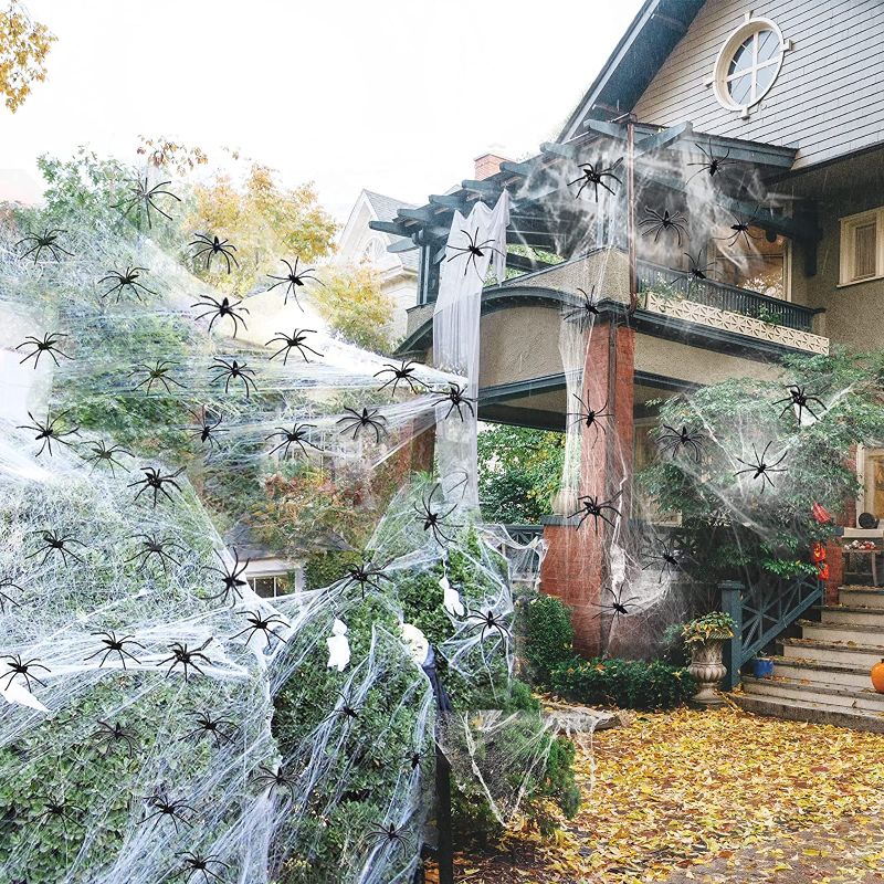 Photo 1 of (  2 PACK) 1000sqft Spider Webs Halloween Decorations, Budbof Stretch Spider Webbing with 80 Pcs Fake Spiders for Indoor Outdoor House Wall Tree Yard Party Decor
