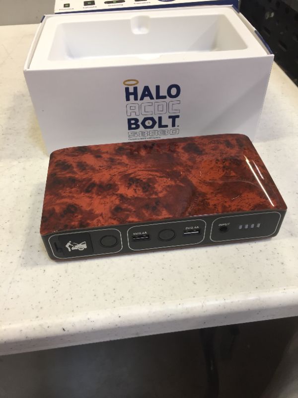 Photo 3 of HALO Bolt 58830 mWh Portable Phone Laptop Charger Car Jump Starter with AC Outlet and Car Charger - Wood Grain
