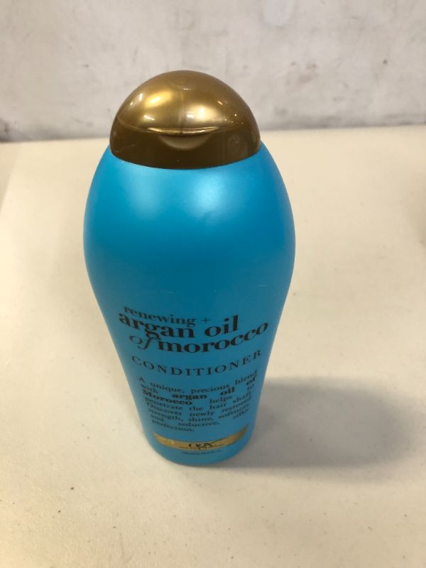 Photo 1 of OGX Renewing + Argan Oil of Morocco Hydrating Hair Conditioner, Cold-Pressed Argan Oil to Help Moisturize, Soften & Strengthen Hair, Paraben-Free with Sulfate-Free Surfactants, 25.4 fl oz