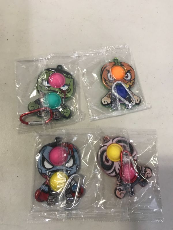 Photo 1 of 4 pcs keychain fidget poppers