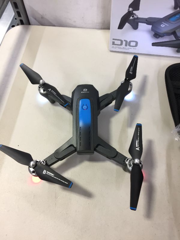 Photo 4 of DEERC Drone with Camera for Adults 1080P FHD FPV Live Video Gravity Control Altitude Hold with Carrying Case 2 Batteries Double the Flight Time Color Blue
