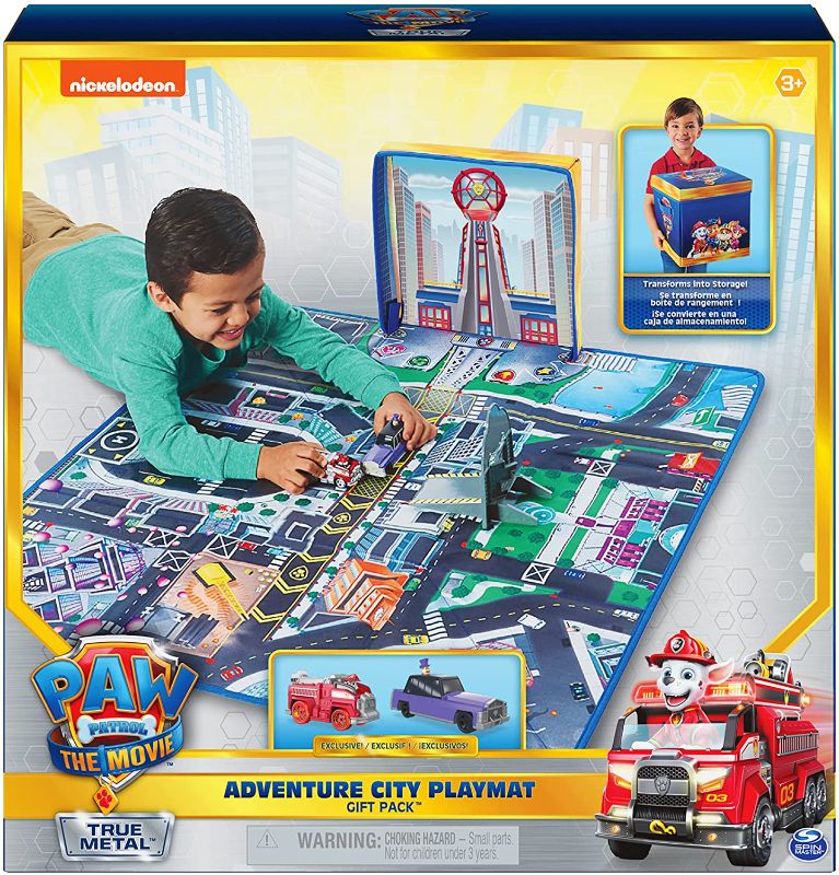 Photo 1 of Paw Patrol, True Metal Adventure City Movie Play Mat Set with 2 Exclusive Toy Cars (POSSIBLY MISSING PIECES, PET HAIR ON ITEM)