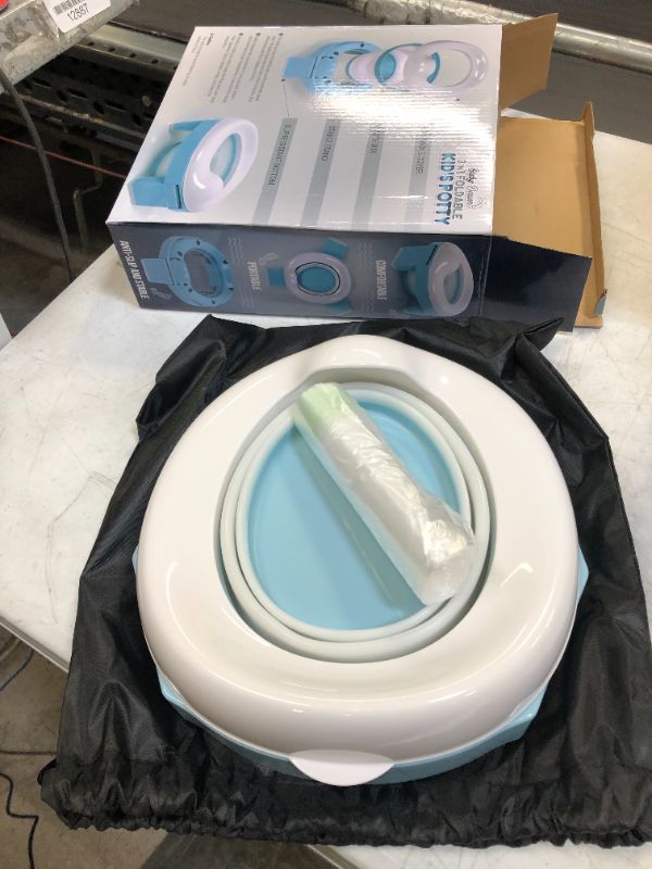 Photo 1 of BABY DAWN Portable Potty for toddler kids - Foldable Car Travel Potty training toilet, with Potty Liners and Storage Bag.