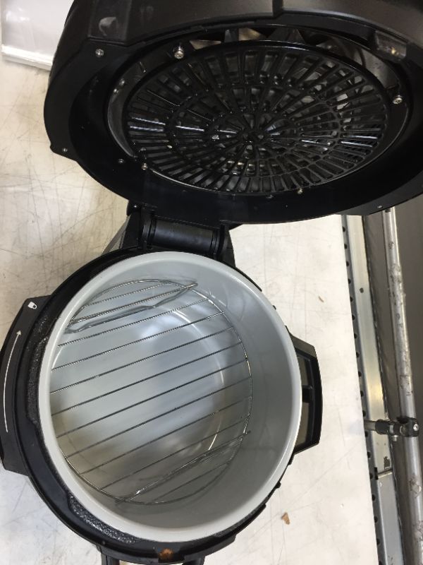 Photo 1 of Ninja FD302 Foodi 11-in-1 Pro 6.5 qt. Pressure Cooker & Air Fryer that Steams, Slow Cooks, Sears, Sautés, Dehydrates & More, with 4.6 qt. Crisper Plate, Nesting Broil Rack & Recipe Book, Silver/Black