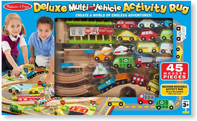 Photo 1 of Melissa & Doug Deluxe Multi-Vehicle Activity Rug (39.5" x 36.5") - 19 Vehicles, 12 Wooden Signs, Train Tracks