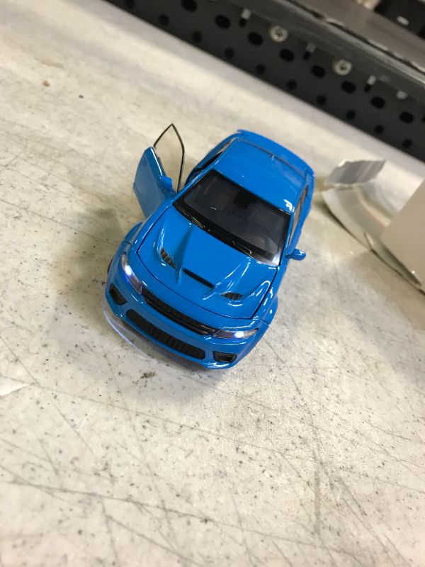 Photo 3 of blue die cast charger hellcat with working lights and sounds 