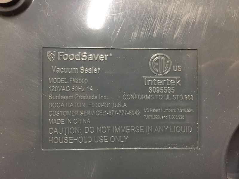 Photo 4 of FoodSaver Vacuum Sealer Machine with Starter Vacuum Seal Bags & Rolls, Safety Certified, Black - FM2000-FFP
