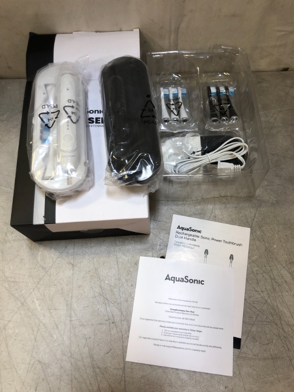 Photo 2 of AquaSonic Duo Dual Handle Ultra Whitening 40,000 VPM Wireless Charging Electric ToothBrushes - 3 Modes with Smart Timers - 10 Dupont Brush Heads & 2 Travel Cases Included
