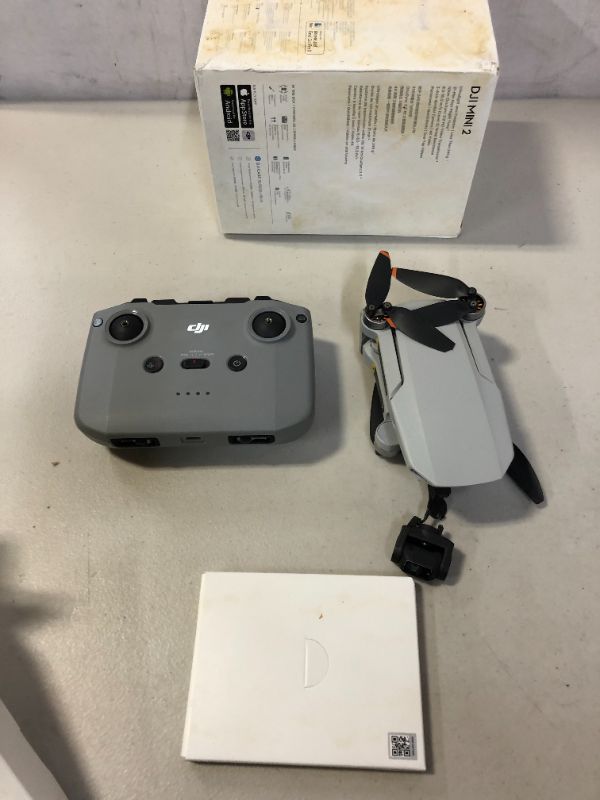 Photo 2 of DJI Mini 2 – Ultralight and Foldable Drone Quadcopter (parts only, major damages to item and packaging, missing pieces)