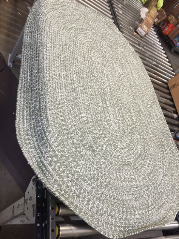 Photo 1 of 6FT GREEN OVAL RUG. 