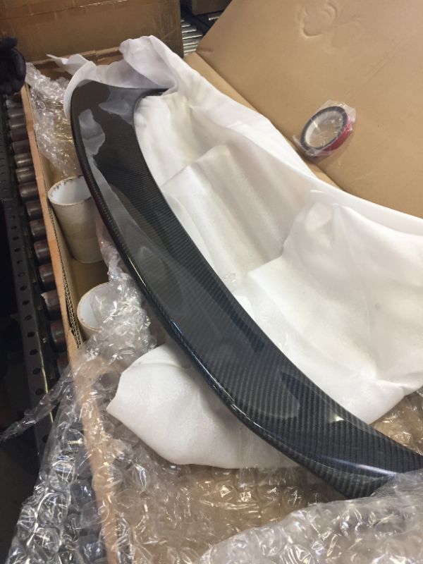 Photo 1 of carbon fiber trunk lip for unknown vehicle with 2 rolls of tape 
