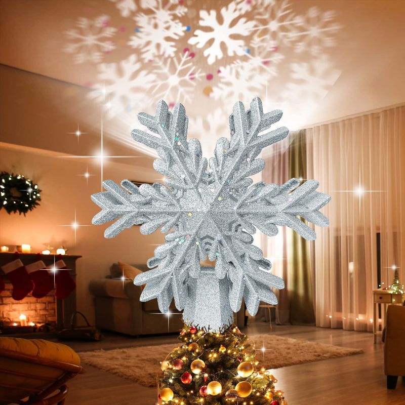 Photo 1 of Christmas Tree Topper, BLVRYVIO Tree Toppers Christmas Decorations,3D Silver Hollow Glitter Christmas Tree Toppers, Christmas Tree Topper Lighted with Rotating Colorful Snowflakes LED Projector
