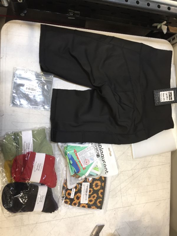 Photo 1 of Clothing and face mask bundle, women's sport shorts size XS sold as is