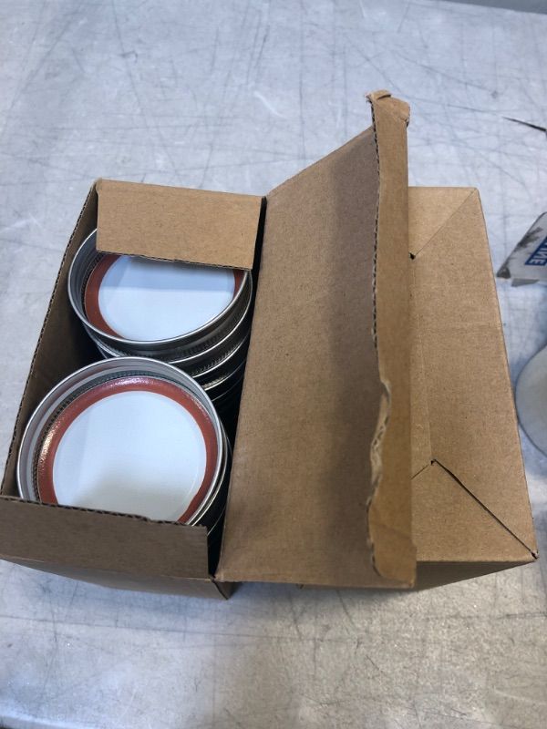 Photo 1 of 2 boxes ( canning lids ) 