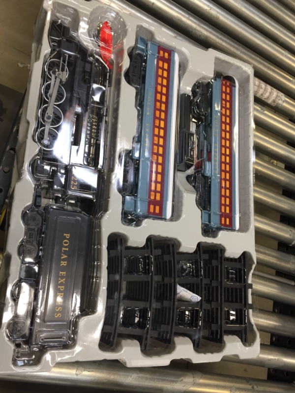 Photo 2 of Lionel The Polar Express battery-powered Train Set with Remote + 12-Piece Straight Track Expansion Pack
