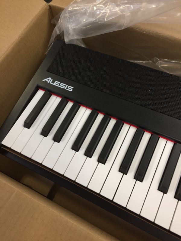 Photo 1 of Alesis Recital – 88 Key Digital Piano Keyboard with Semi Weighted Keys, 2x20W Speakers, 5 Voices, Split, Layer and Lesson Mode, FX and Piano Lessons