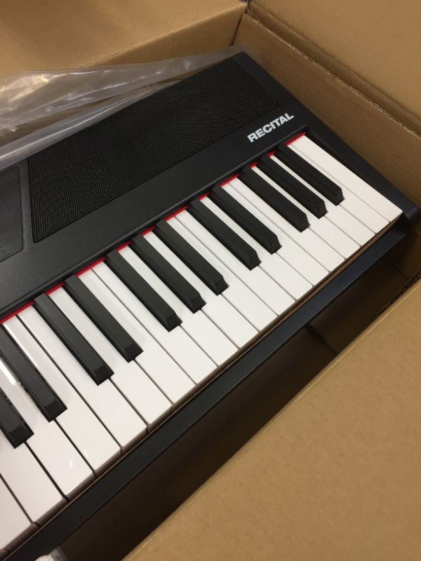 Photo 1 of Alesis Recital – 88 Key Digital Piano Keyboard with Semi Weighted Keys, 2x20W Speakers, 5 Voices, Split, Layer and Lesson Mode, FX and Piano Lessons
