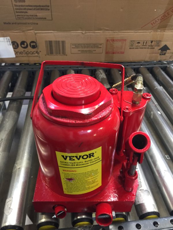 Photo 2 of Air Hydraulic Bottle Jack 50 Ton Manual 110231lb MISSING SOME METAL RODS 
