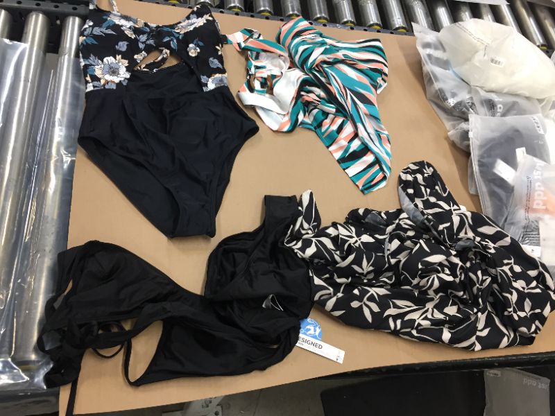 Photo 1 of 4 pack medium clothing and bathing suit