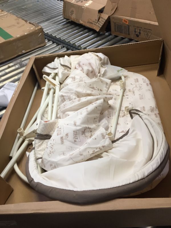 Photo 1 of Delta Children Deluxe Sweet Beginnings Bedside Bassinet - Portable Crib with Lights and Sounds, Falling Leaves
