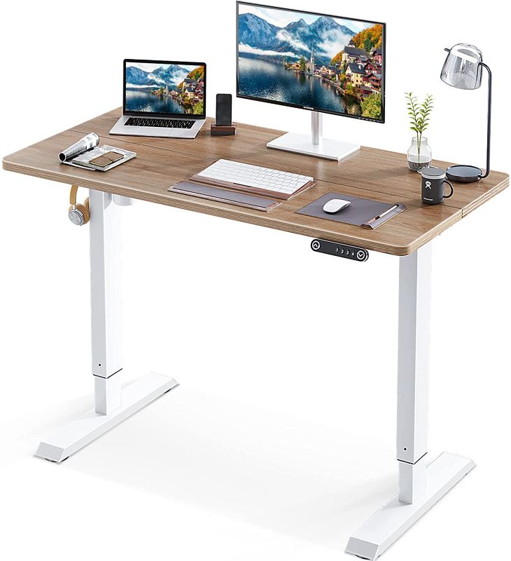 Photo 1 of KKL 48-inch Height Adjustable Electric Standing Desk, 48 x 24 Inches Stand Up Desk with Splice Board and Hook, Sit Stand Desk with Greige Top and White Frame
