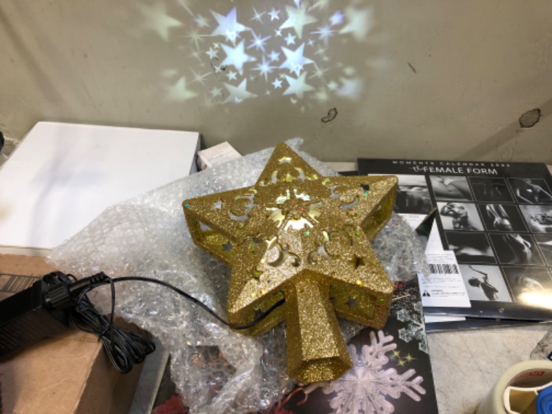 Photo 1 of FOGEEK Christmas Tree Toppers Gold Star Christmas Tree Topper Lighted Christmas 3D Glitter Rotating LED Hollow Glitter Projector Xmas Tree Toppers Tree Decorations for Christmas Indoor
