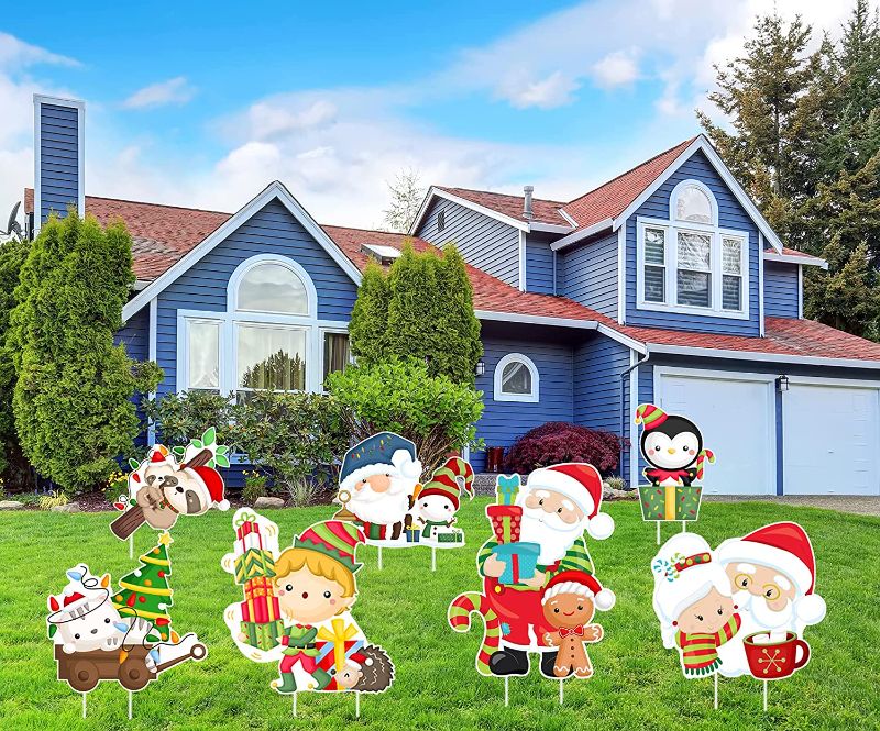 Photo 1 of GARNETIN Christmas Decorations Outdoor, 7Pcs Merry Christmas Yard Signs with Stakes Cartoons Santa Xmas Holiday Signs - Christmas Yard Decorations for Home Garden Patio Lawn Candyland Party - 2 PACK 
