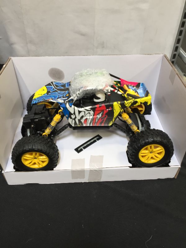 Photo 4 of DOUBLE E RC Car 4WD Remote Control Car 2 Batteries Unique Colorful Shell Off Road Monster Truck 2 Powerful Motors Climbing RC Crawler Toy Cars for Boys Girls Kids
