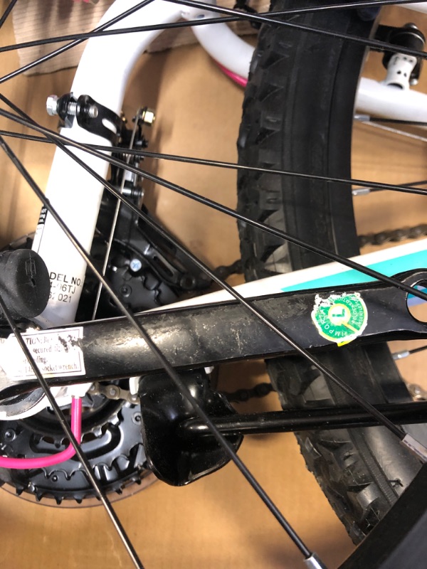 Photo 1 of Dynacraft Vertical Dual Suspension Mountain Bike Girls 24 Inch Wheels with 18 Speed Grip Shiter and Dual Hand Brakes in Teal and Pink
