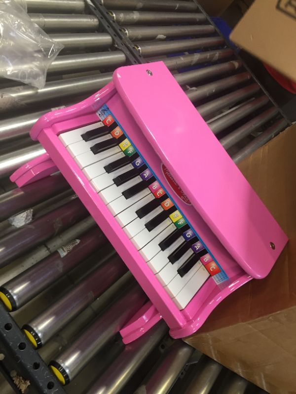 Photo 4 of Melissa & Doug Learn-to-Play Pink Piano With 25 Keys and Color-Coded Songbook
