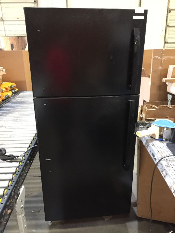 Photo 2 of Insigna black refrigerator       -- and there are some parts that are dirty 