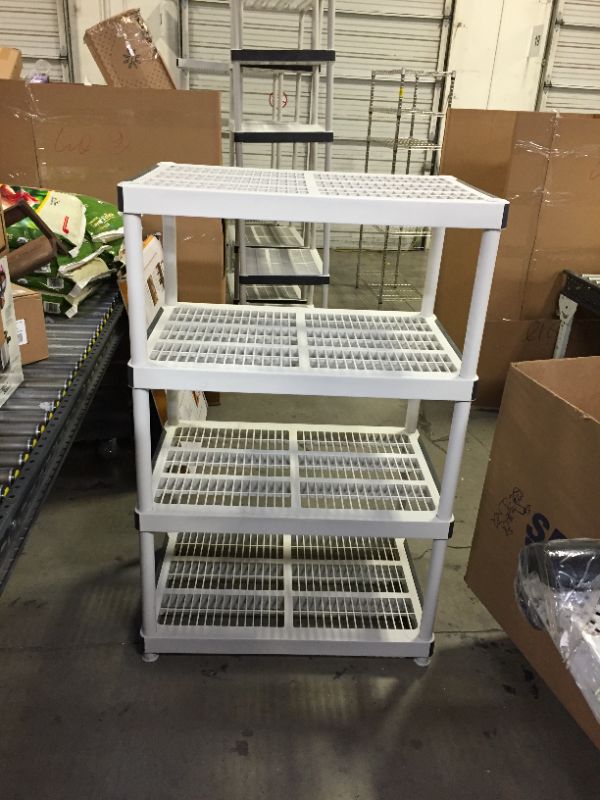 Photo 1 of 4 tier plastic shelves 24"x36" 