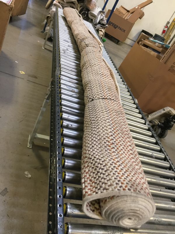 Photo 1 of 12X10FT WOVEN RUG. ORANGE BROWN AND WHITE PATTERN.