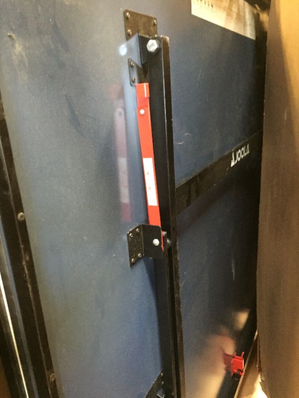 Photo 9 of JOOLA Inside - Professional MDF Indoor Table Tennis Table with Quick Clamp Ping Pong Net and Post Set - 10 Minute Easy Assembly - Ping Pong Table with Single Player Playback Mode
corner damage
