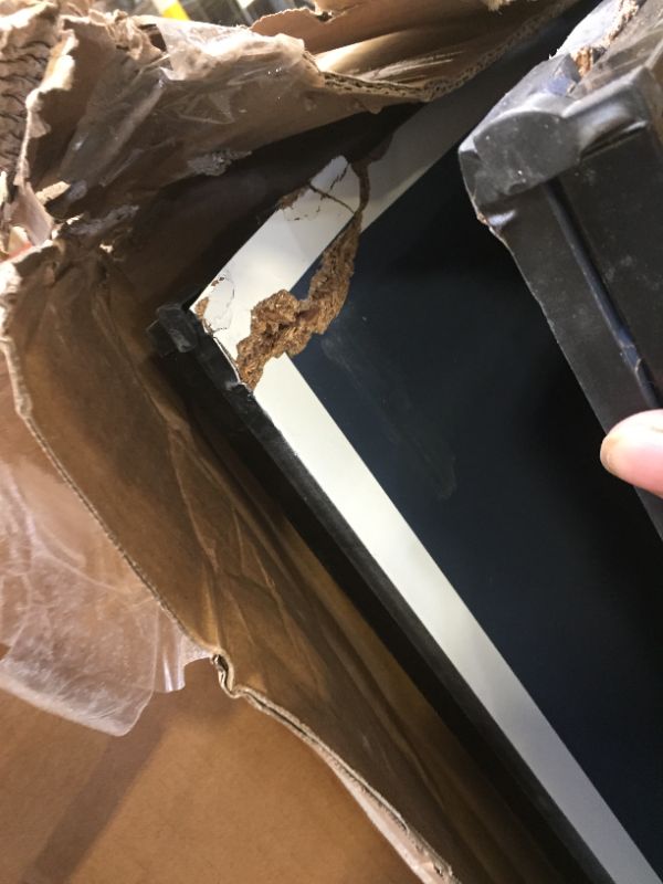 Photo 2 of JOOLA Inside - Professional MDF Indoor Table Tennis Table with Quick Clamp Ping Pong Net and Post Set - 10 Minute Easy Assembly - Ping Pong Table with Single Player Playback Mode
corner damage
