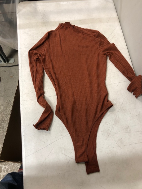 Photo 1 of Generic Rust Colored Long Sleeve Body Suit. Medium