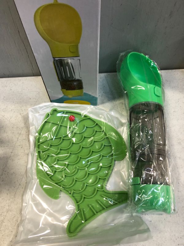 Photo 1 of  PET MULTIFUNCTIONAL  GREEN WATER BOTTLE ( PACKAGE WAS SEALED BUT OPEN FOR LIVE PHOTO )