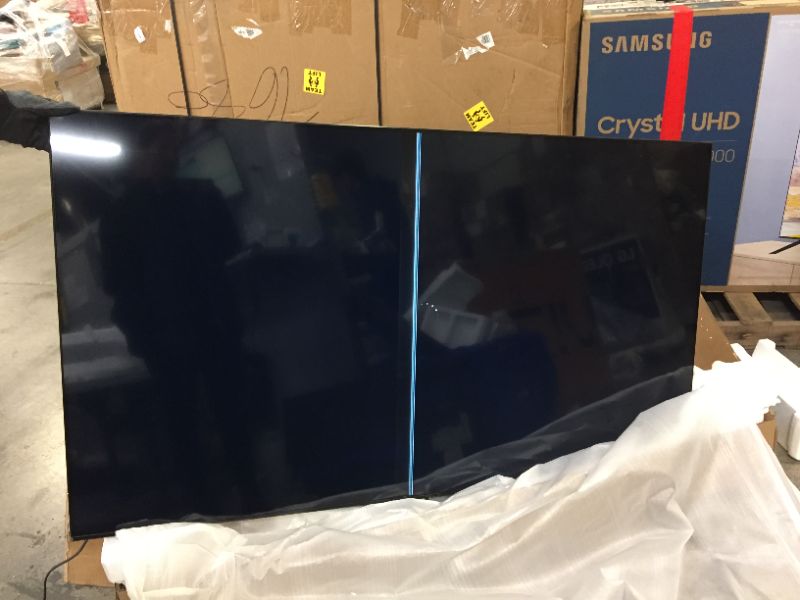 Photo 2 of SAMSUNG 65-inch Class Crystal UHD TU-8000 Series - 4K UHD HDR Smart TV with Alexa Built-in (UN65TU8000FXZA, 2020 Model)
---- LINE IN THE MIDDLE OF THE SCREEN ----