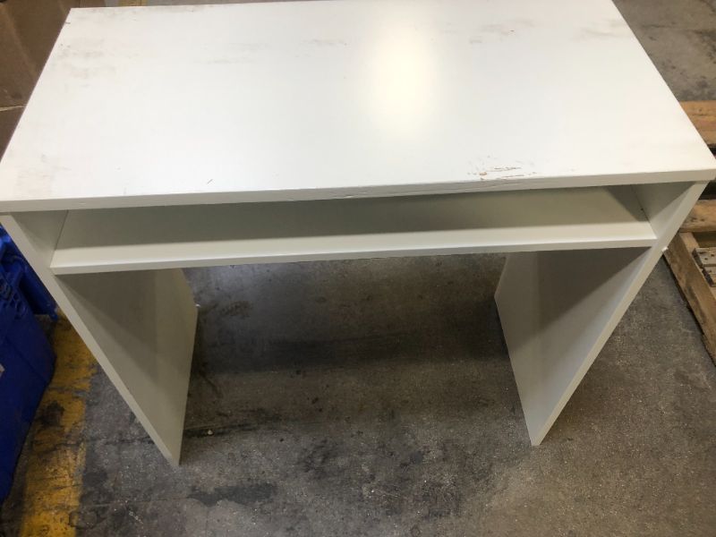 Photo 1 of White Desk 30Lx15Wx30H fully assembled-scratching on the top